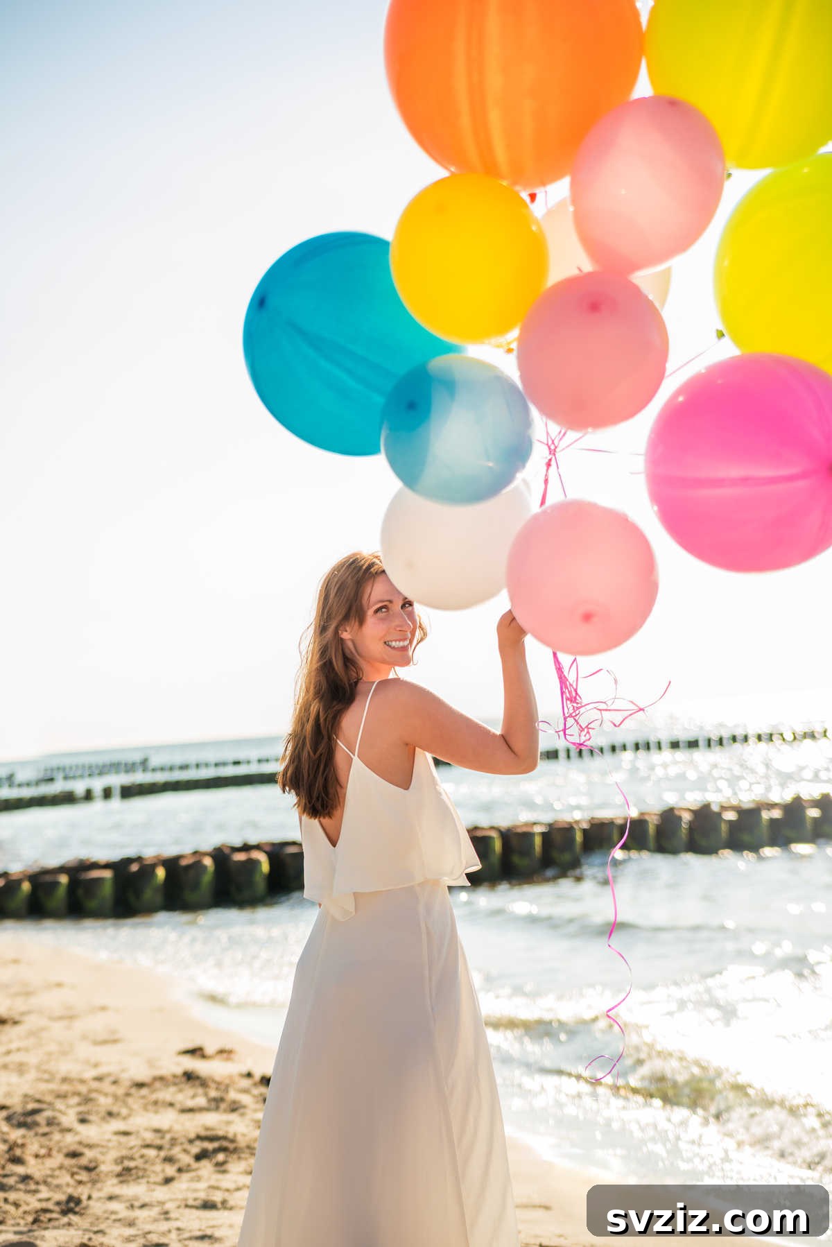 Colorful balloons being released into the sky as a wedding send-off