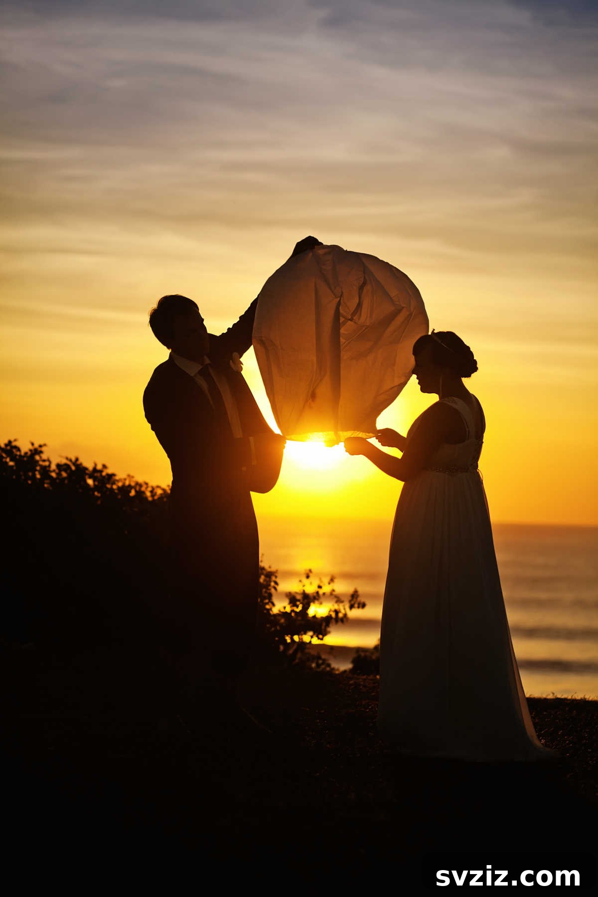 Floating lanterns ascending into the night sky as a wedding send-off