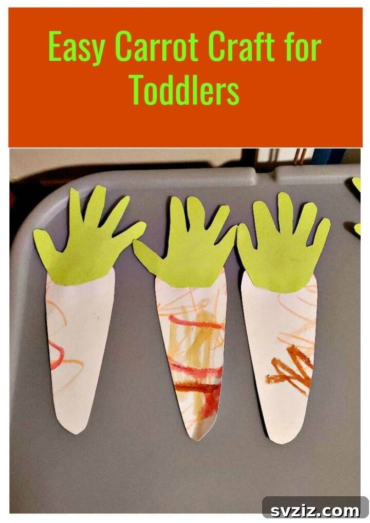A simple and charming handprint carrot craft made with green and orange construction paper, perfect as a keepsake.