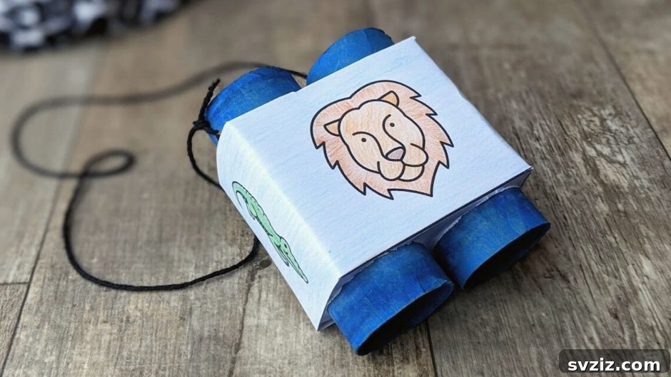 DIY paper tube binoculars with a decorative cover, ideal for imaginative play like safari or bird watching.