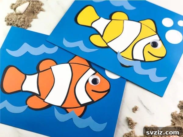 A vibrant clownfish craft made from colored cardstock with googly eyes, inspired by Finding Nemo.