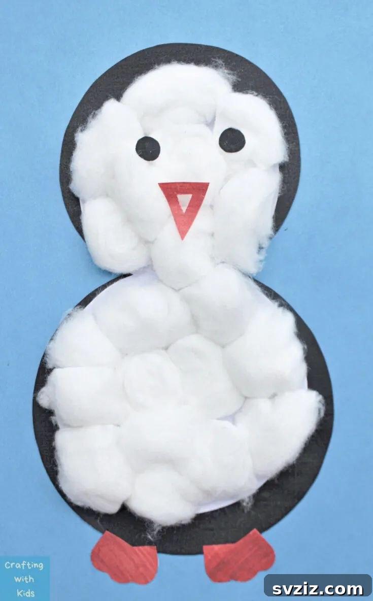 An adorable preschool penguin craft made with paper and cotton balls, perfect for winter-themed activities.