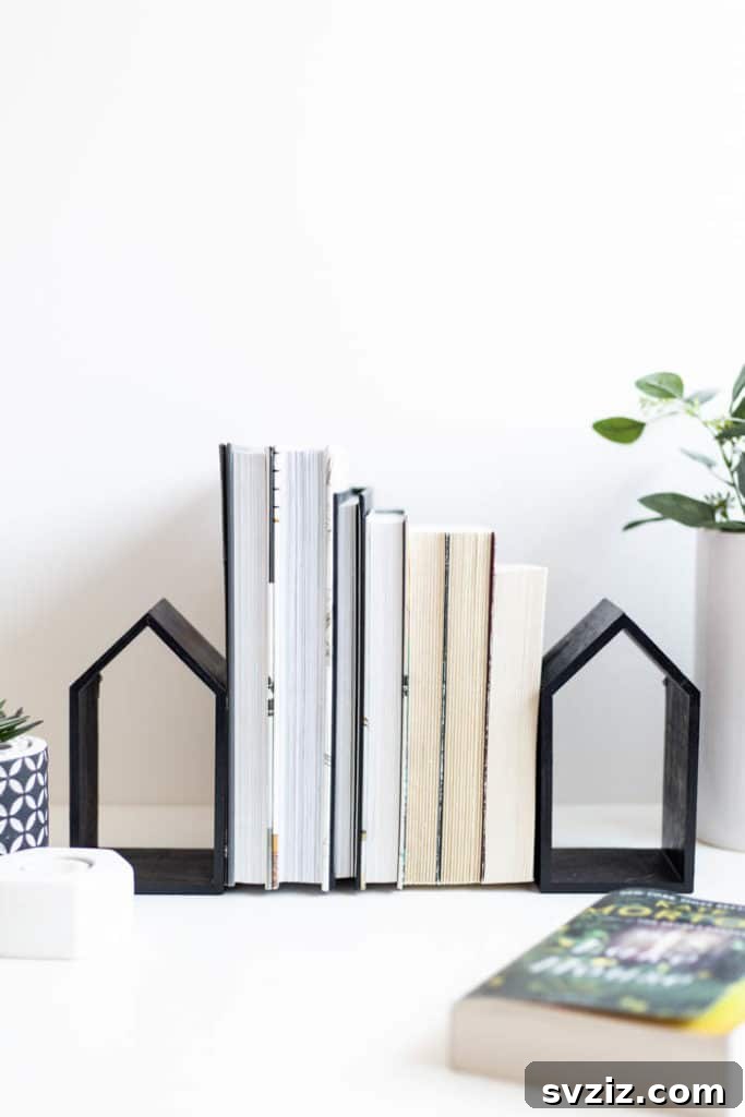 DIY Mini House Book Ends from Dollar Tree wooden frames and spray paint for charming bookshelves