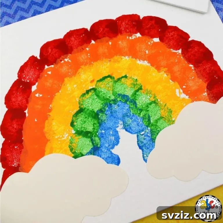 61 Charming & Simple Paintings for Aspiring Artists 29 Cotton Ball Rainbow Painting, a colorful craft for teaching kids colors