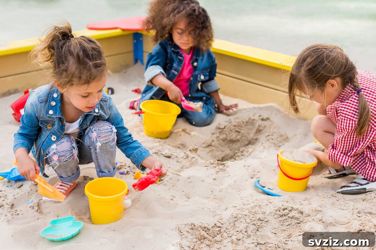 41 Creative Play Ideas for Two-Year-Olds 13 A child happily playing in a sandbox with various toys, digging and building.