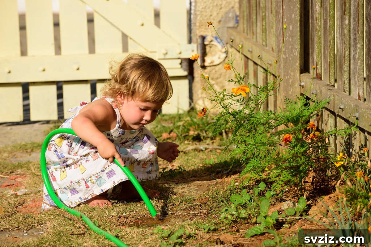 41 Creative Play Ideas for Two-Year-Olds 19 A toddler happily watering an indoor plant with a small watering can.