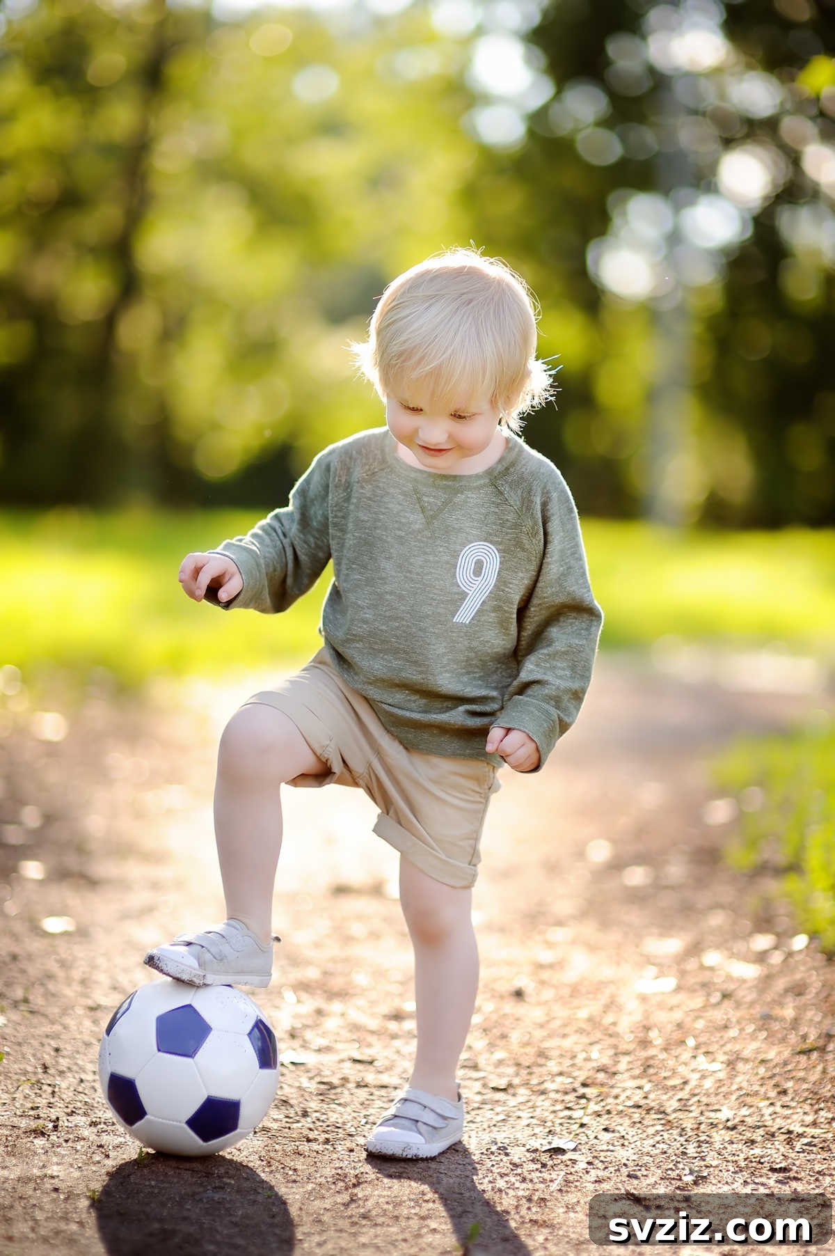 41 Creative Play Ideas for Two-Year-Olds 23 A parent and toddler joyfully passing a soft ball back and forth.