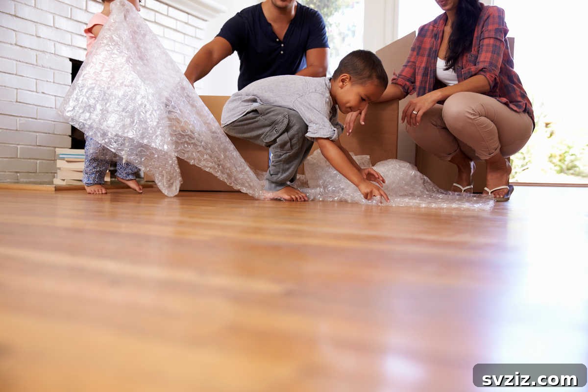 41 Creative Play Ideas for Two-Year-Olds 27 A child creating textured art by pressing bubble wrap onto paint.