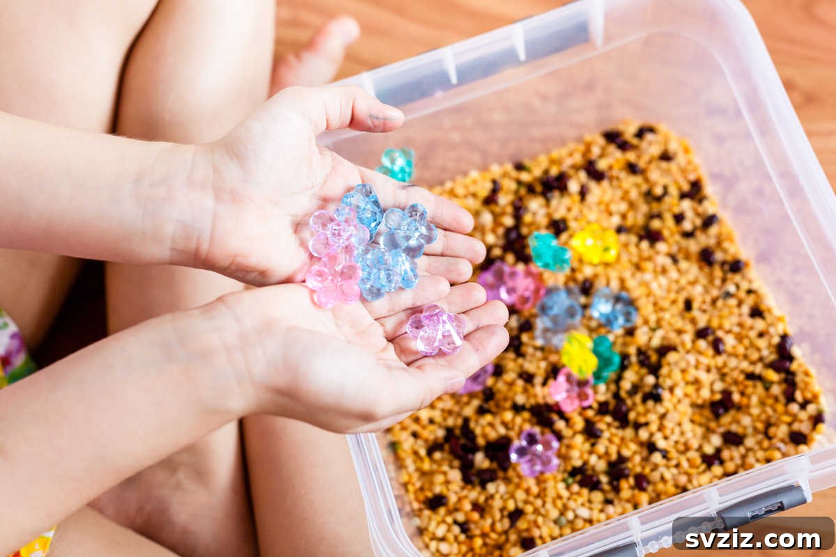 41 Creative Play Ideas for Two-Year-Olds 10 A sensory bin filled with colorful flower petals and natural elements.
