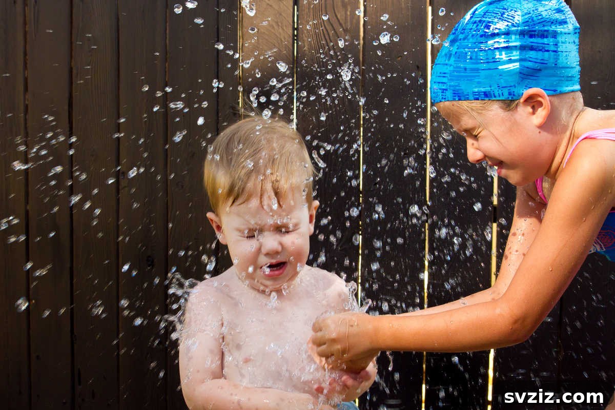 Excited boys throwing water balloons during a fun outdoor water fight, a classic summer activity.
