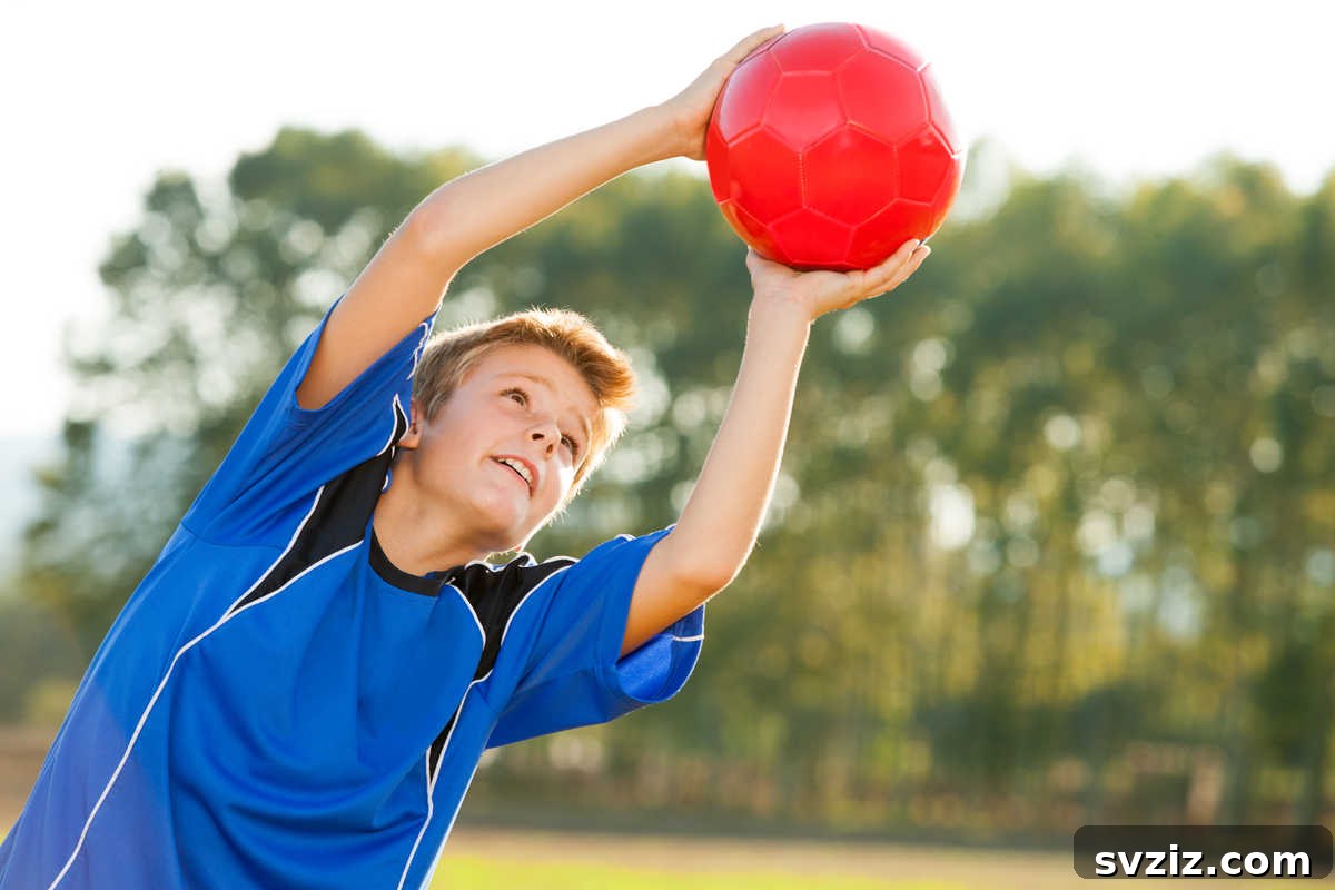 Adult and child playing catch with a baseball glove and ball in a green field, fostering connection.