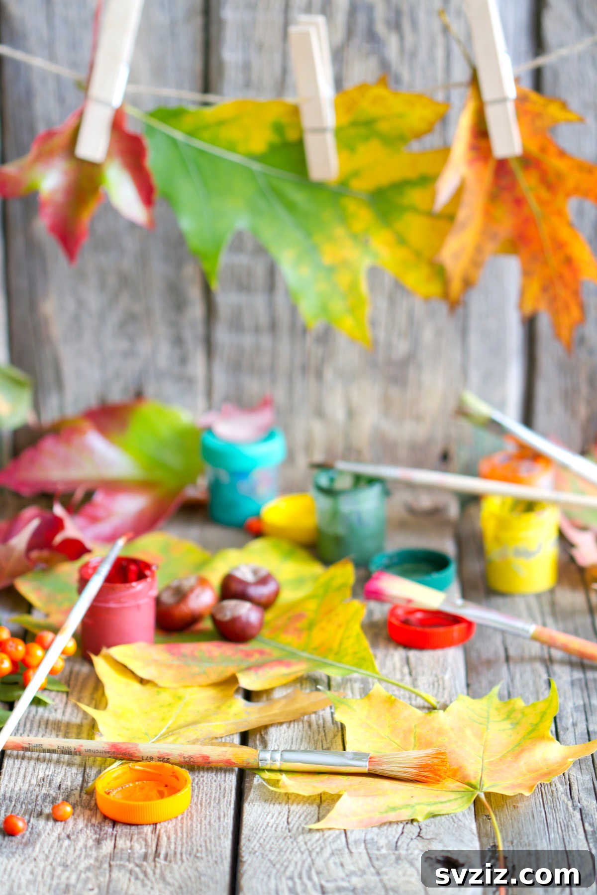Child holding a homemade nature paintbrush made from twigs and leaves, ready to paint outdoors.