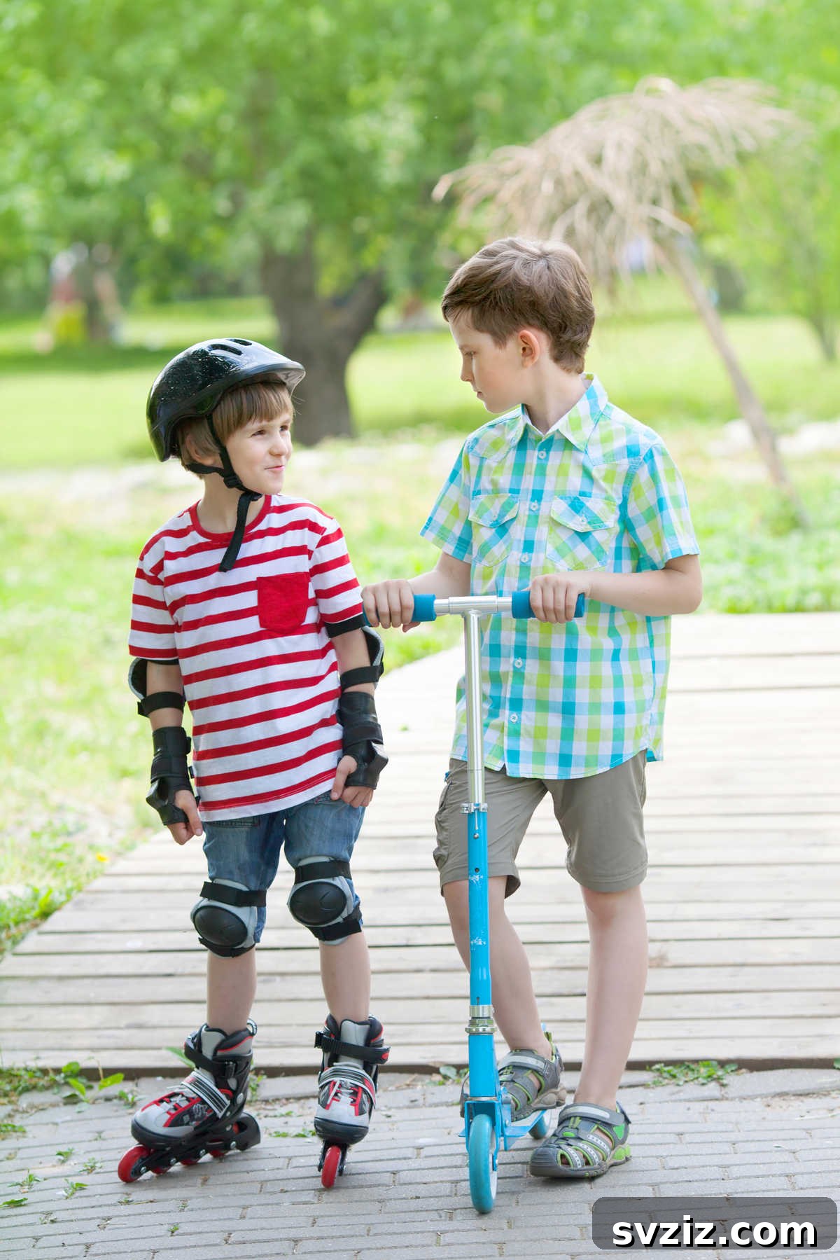 Two boys rollerblading on a paved path, enjoying a dynamic outdoor sport and summer activity.