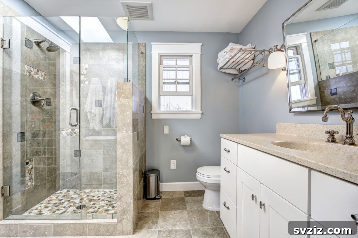 Mosaic tiled walk-in shower wall