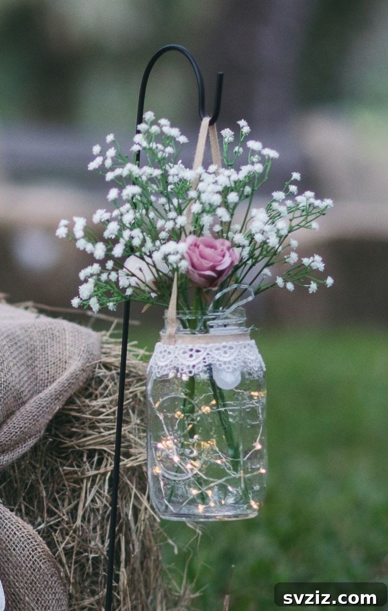 Rustic Wedding Decor with Hanging Mason Jars and Fairy Lights