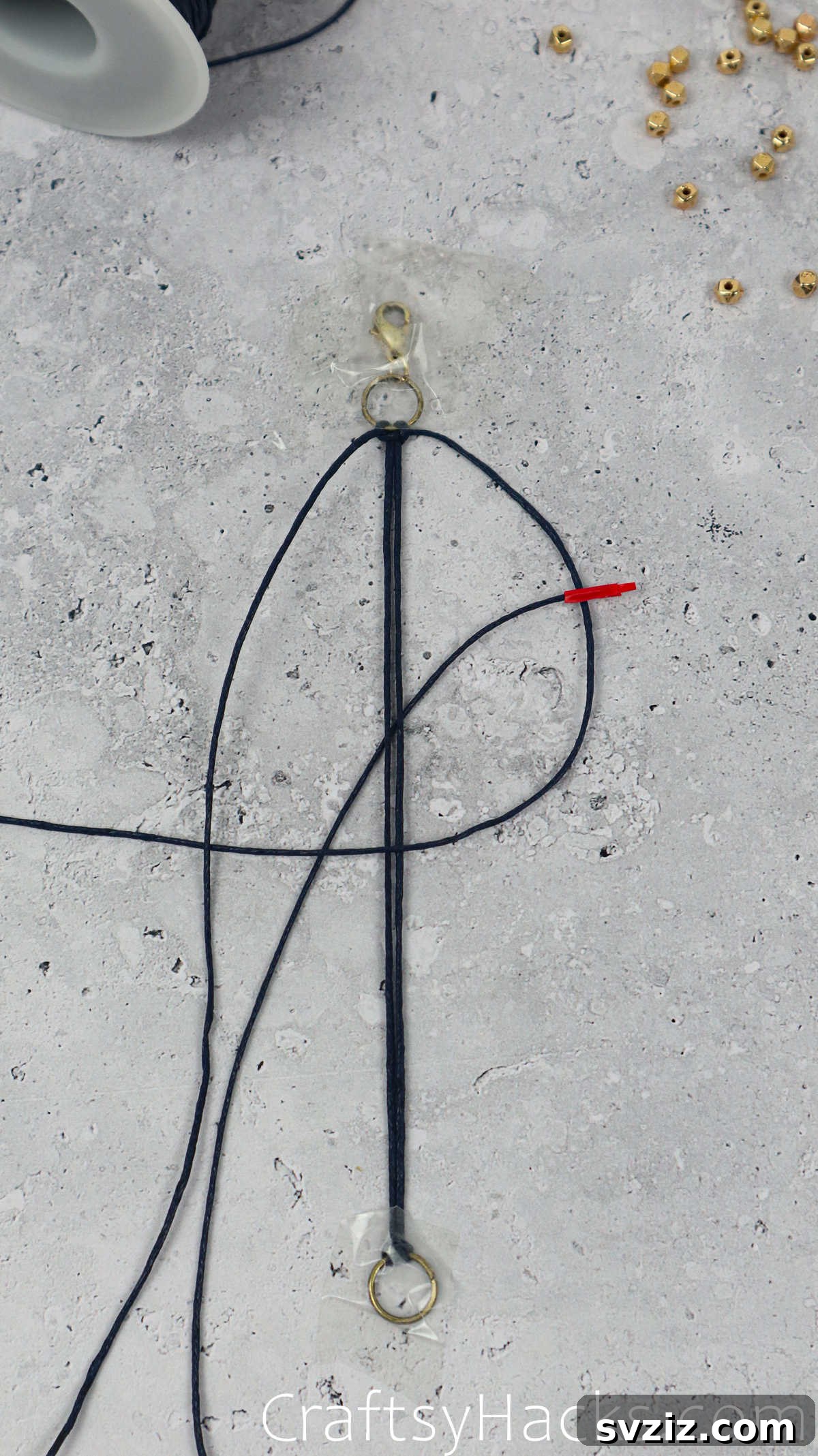 pulling taped cord through loop