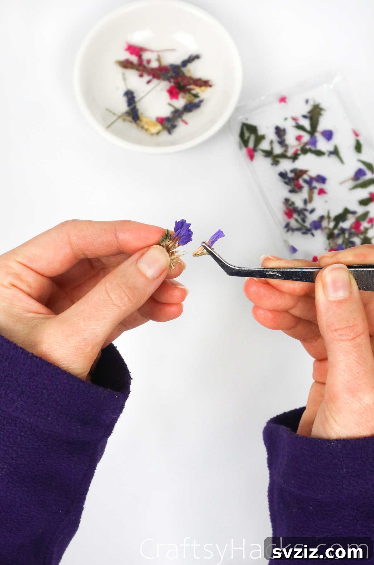 DIY Resin Keychains: Easy Steps for Stunning Accessories 10 holding dried flower with tweezers