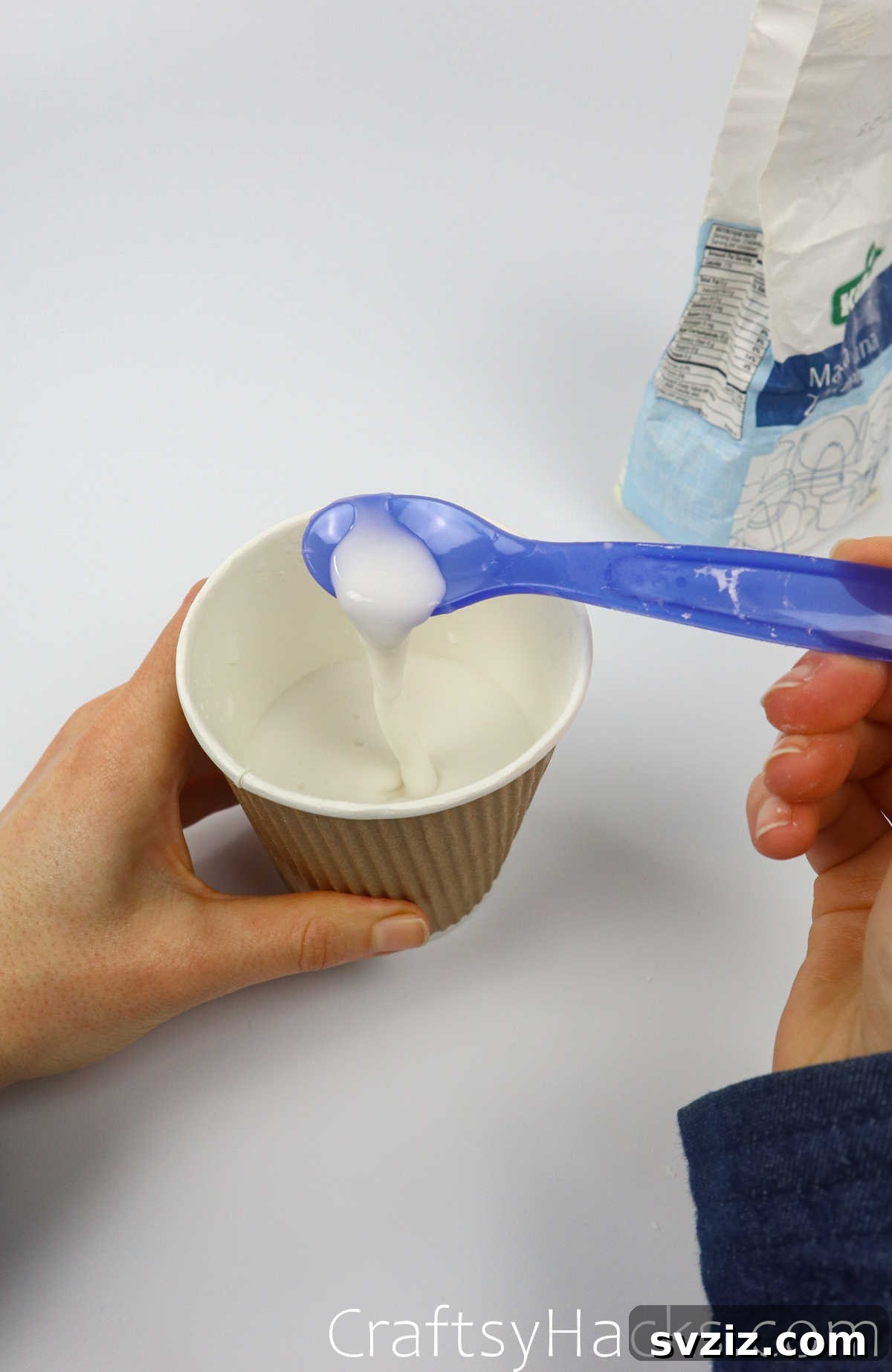 Craft Your Calming Stress Ball 12 Hand mixing the flour and water paste in a bowl