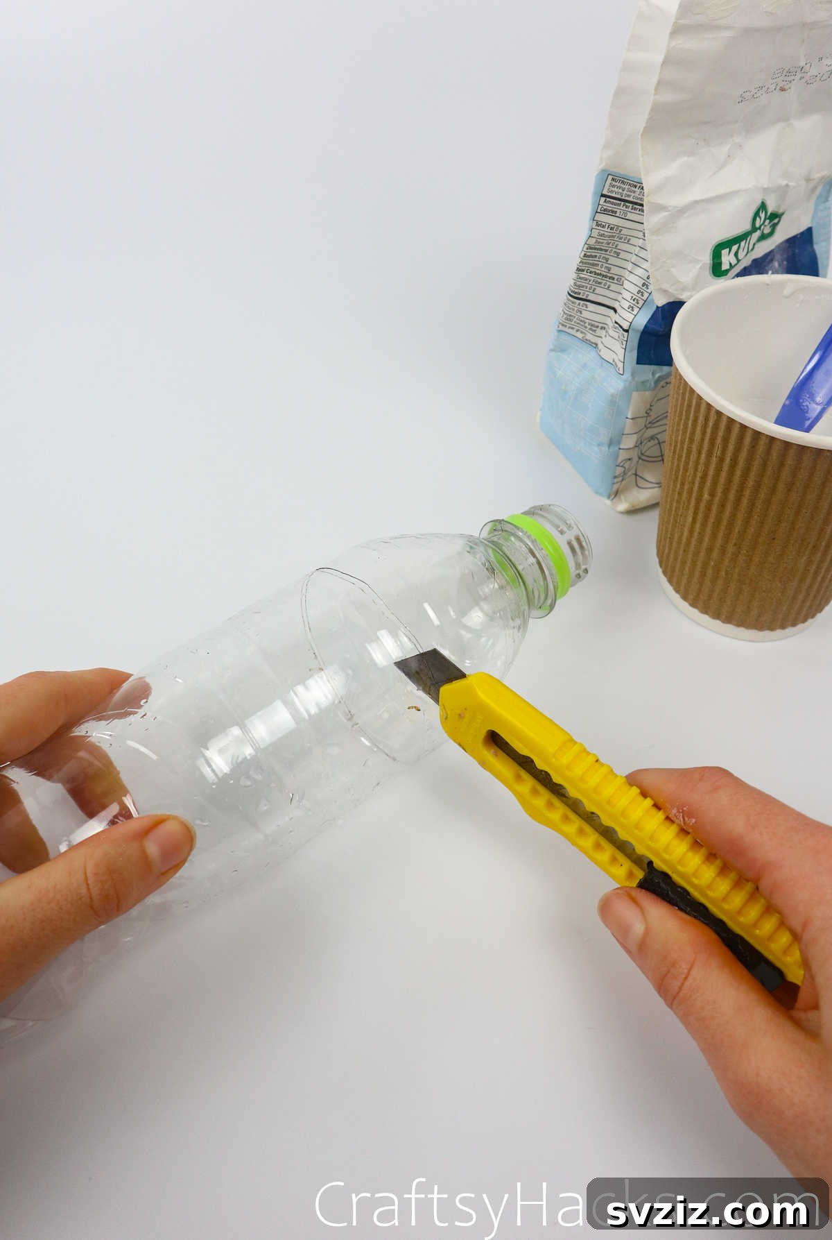 Craft Your Calming Stress Ball 15 An adult cutting the top off a plastic water bottle with a utility knife to create a funnel