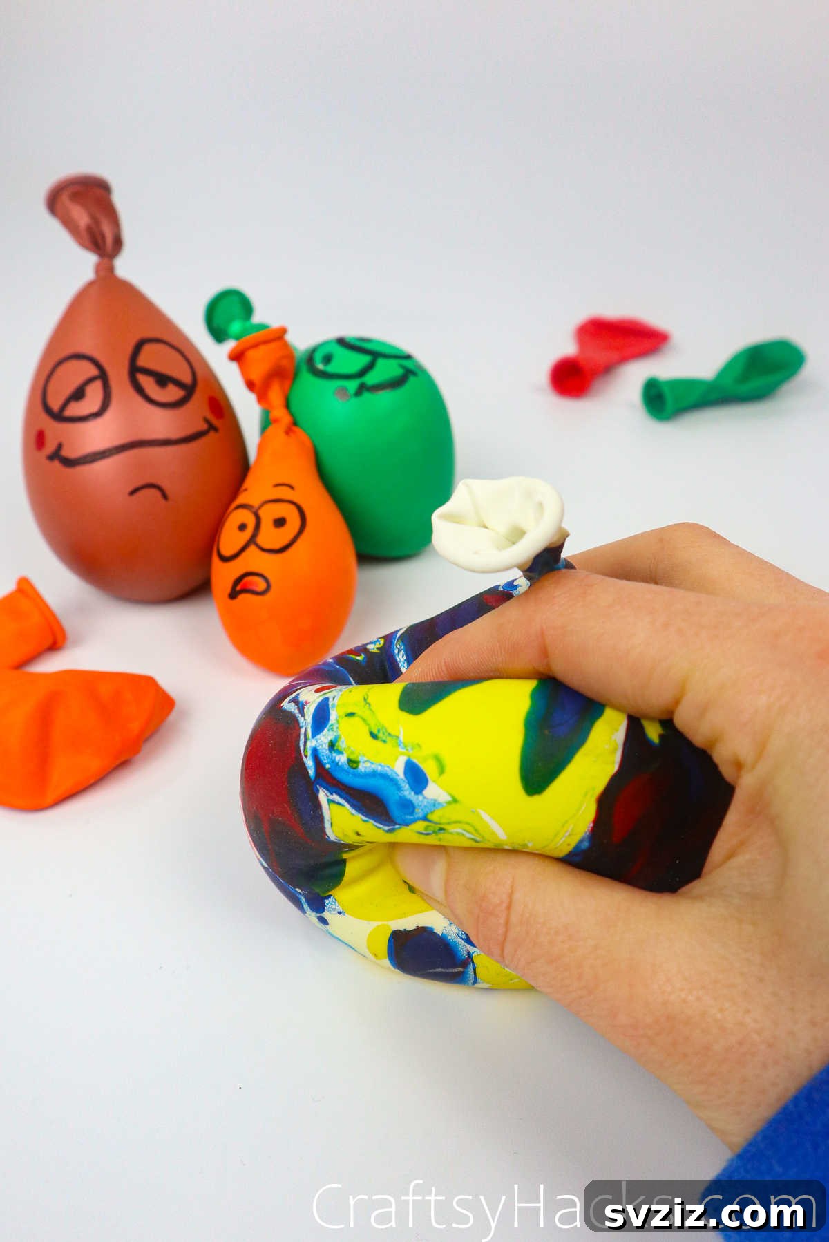 Craft Your Calming Stress Ball 3 Close-up of a hand squishing a blue DIY stress ball