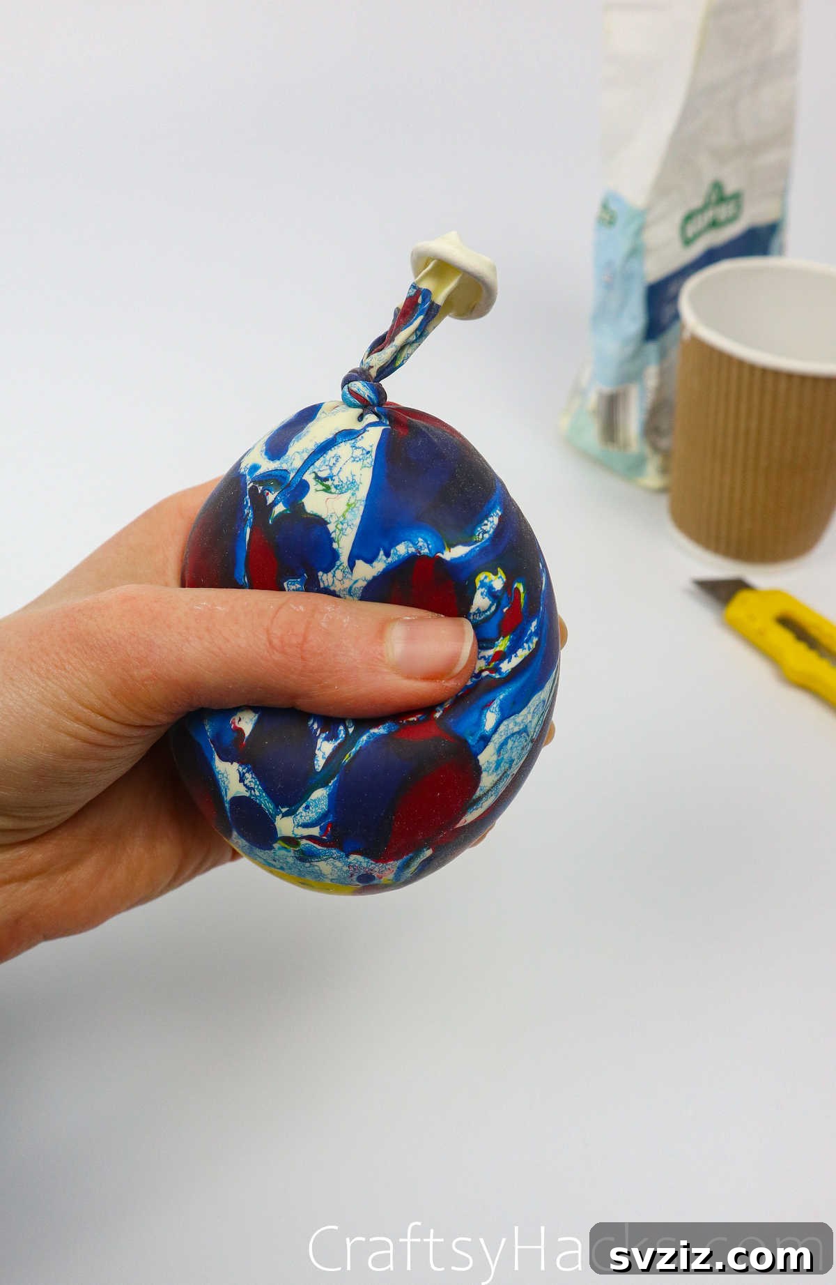 Craft Your Calming Stress Ball 22 Tying a knot at the end of the filled balloon to secure the stress ball