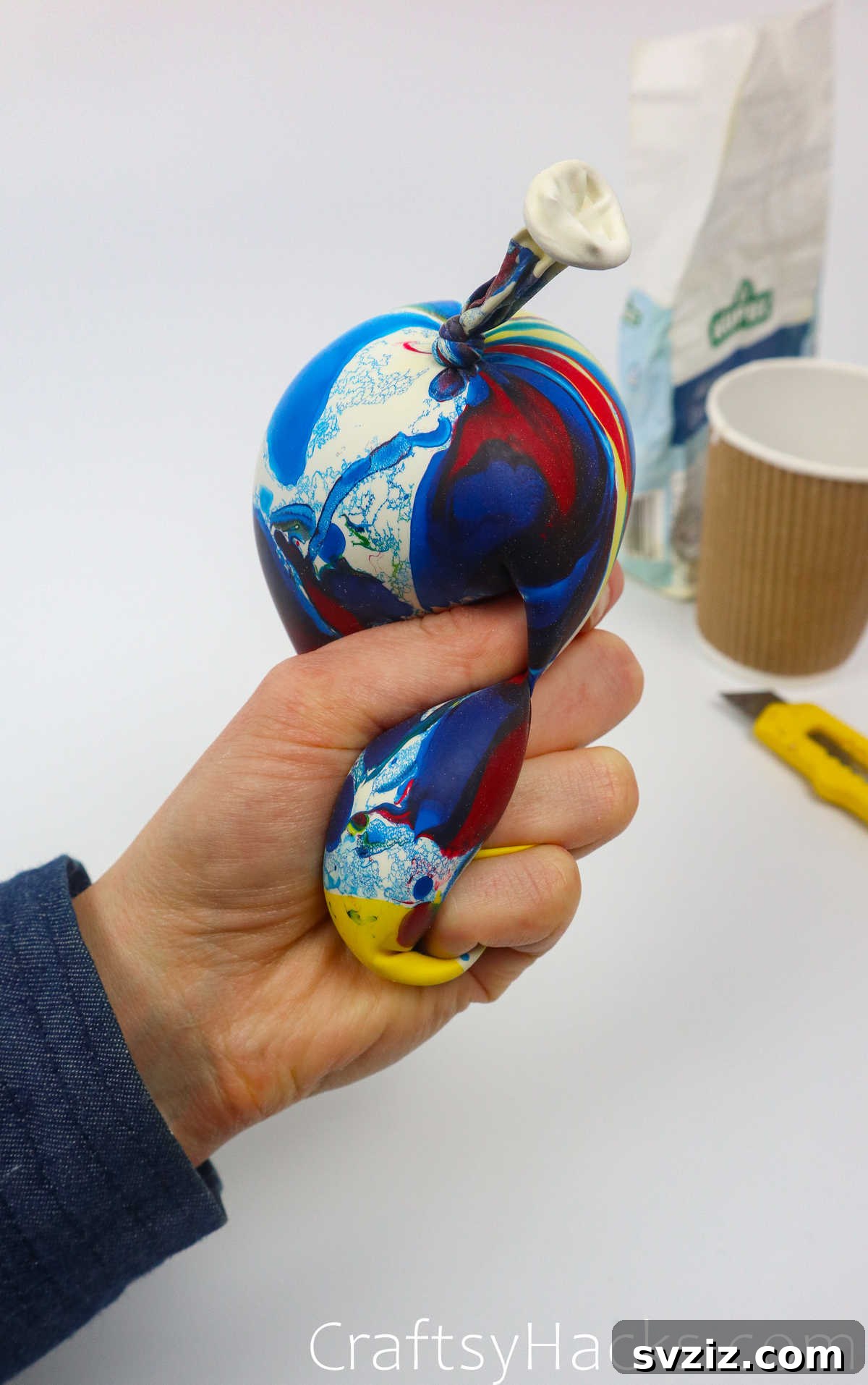 Craft Your Calming Stress Ball 23 A freshly made DIY stress ball being gently squished in a hand