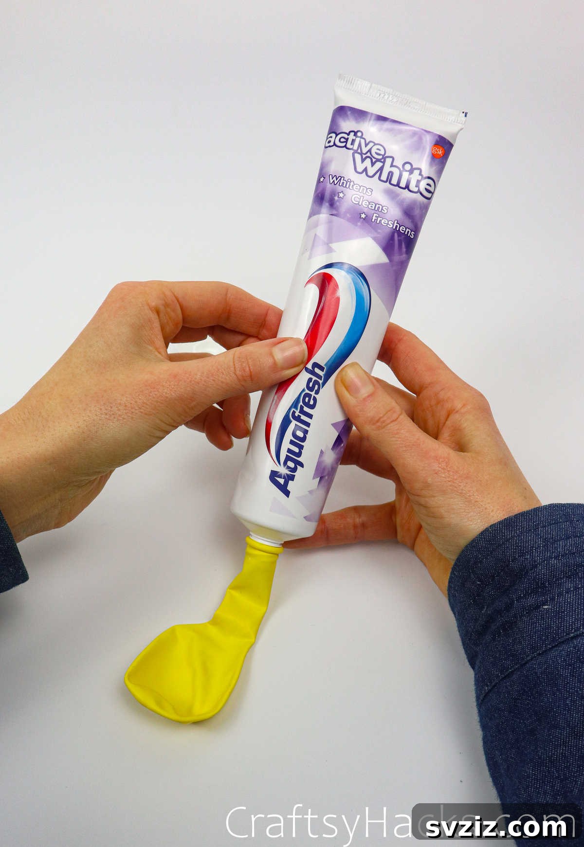 Craft Your Calming Stress Ball 25 Squeezing toothpaste directly into an open balloon to create a stress ball