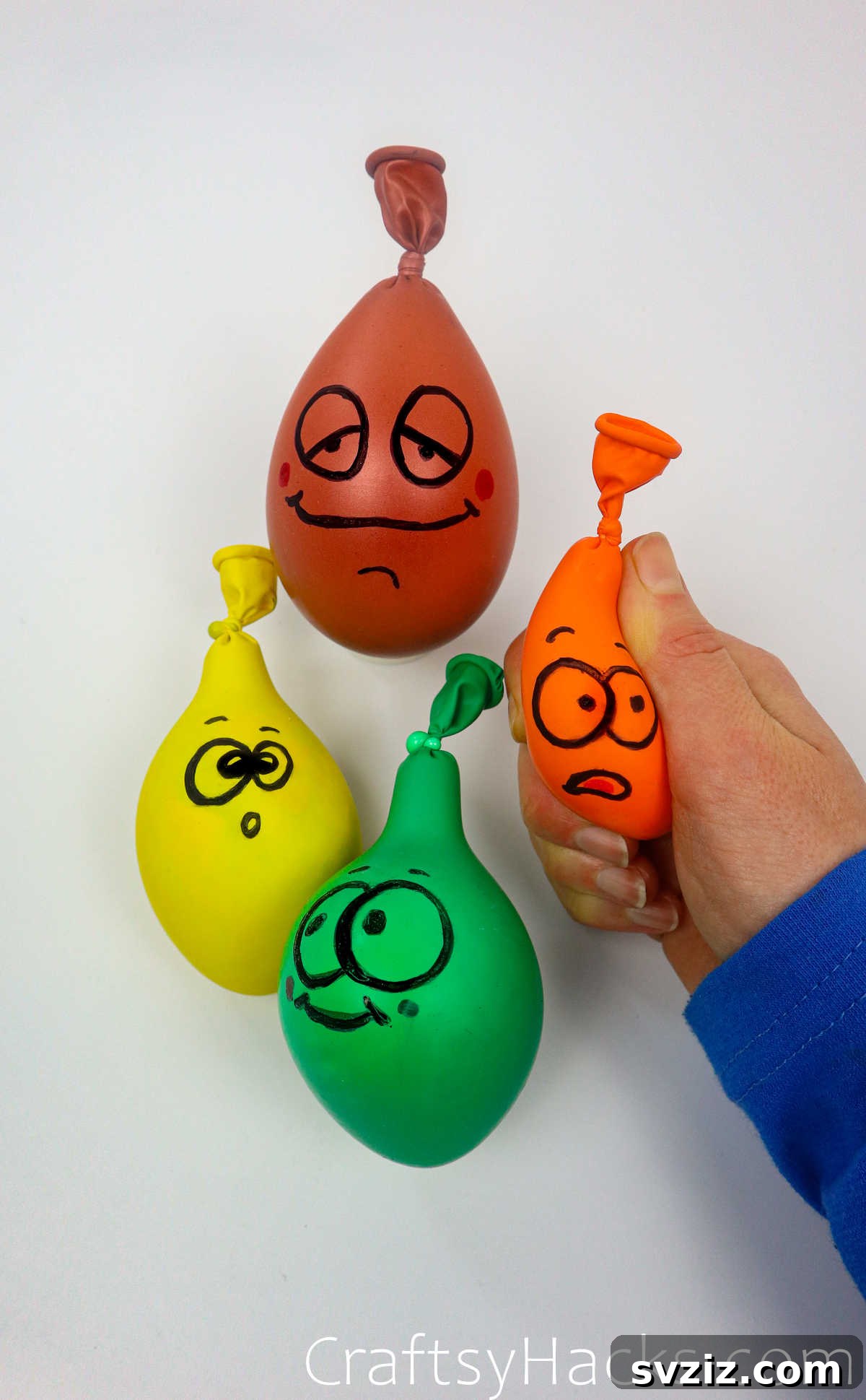 Craft Your Calming Stress Ball 28 A collection of colorful DIY stress balls with various hand-drawn faces and emojis