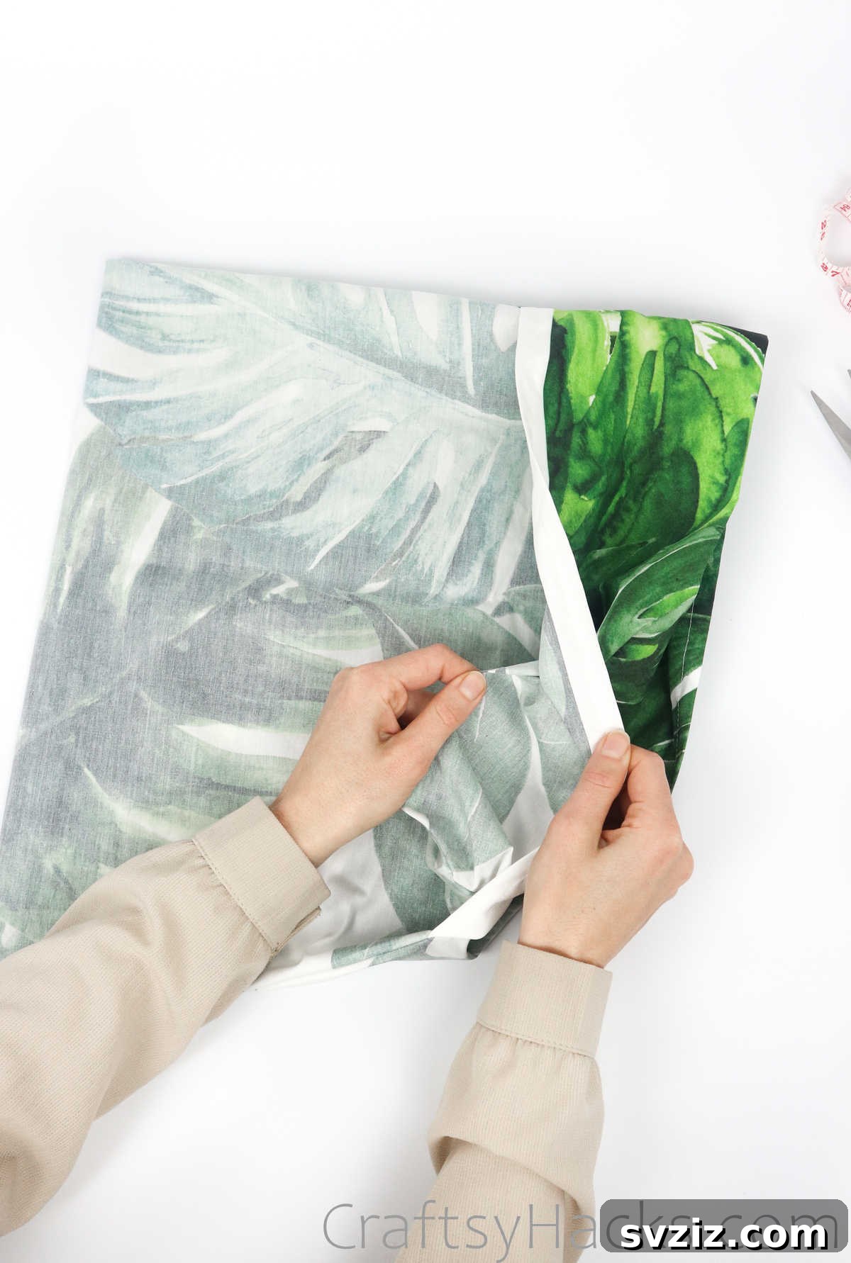 Folding the fabric flap inside out for a clean finish
