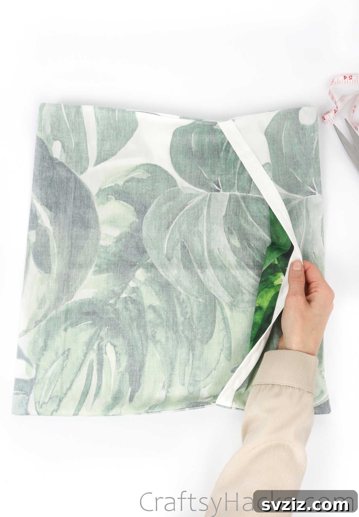 Turning the fabric inside out, revealing the wrong side