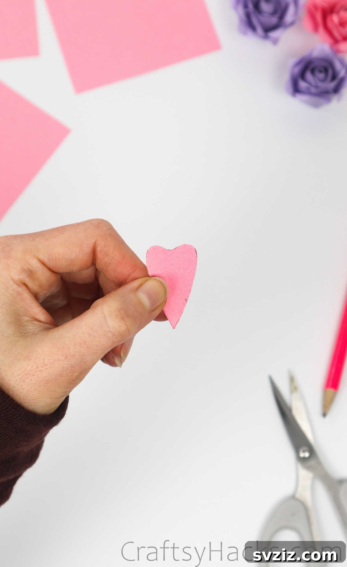Your Simple Guide to Gorgeous Paper Roses 15 The cut-out paper, still folded, revealing the shape that will become petals