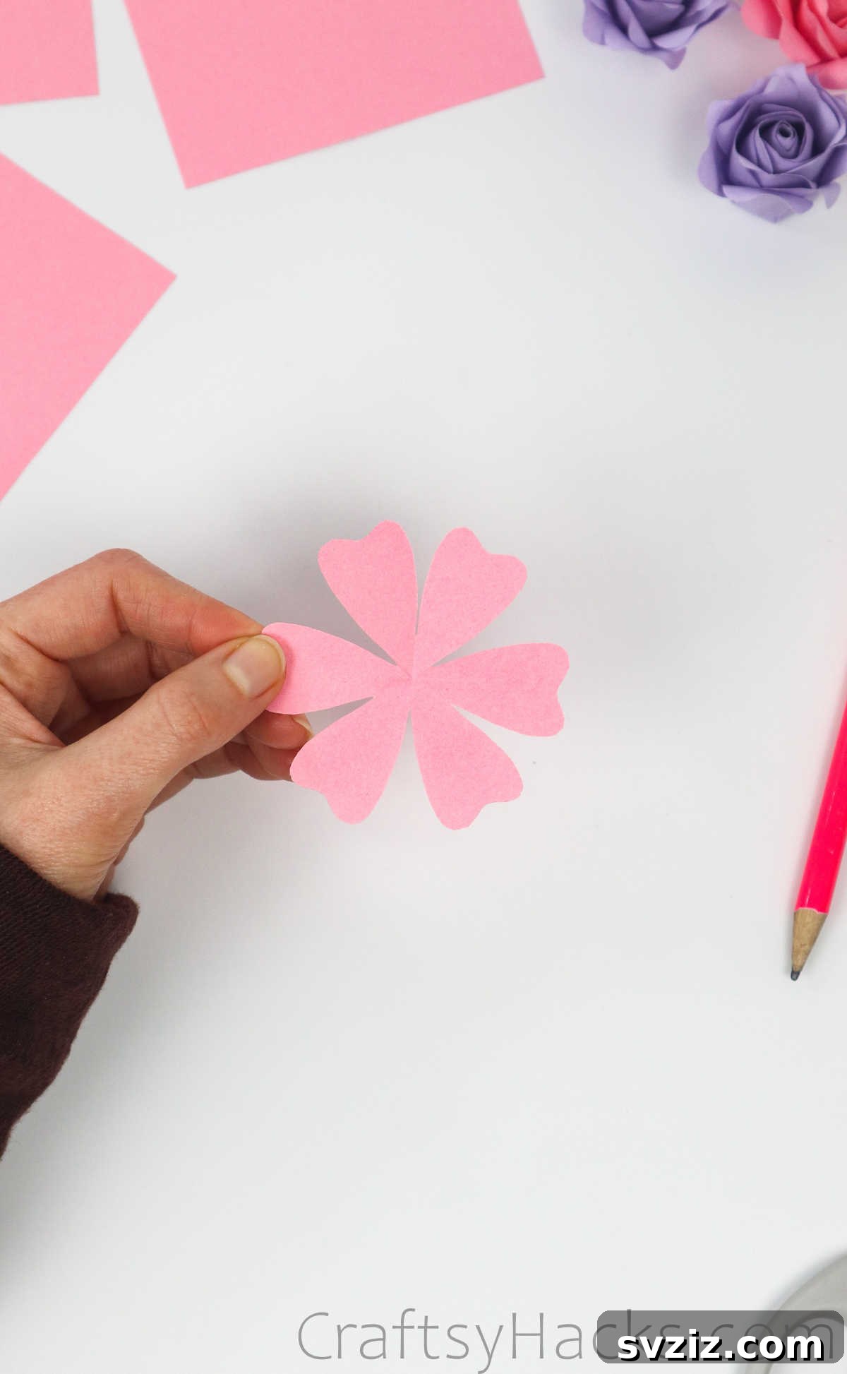 Your Simple Guide to Gorgeous Paper Roses 16 The unfolded paper revealing a perfect six-petal flower shape