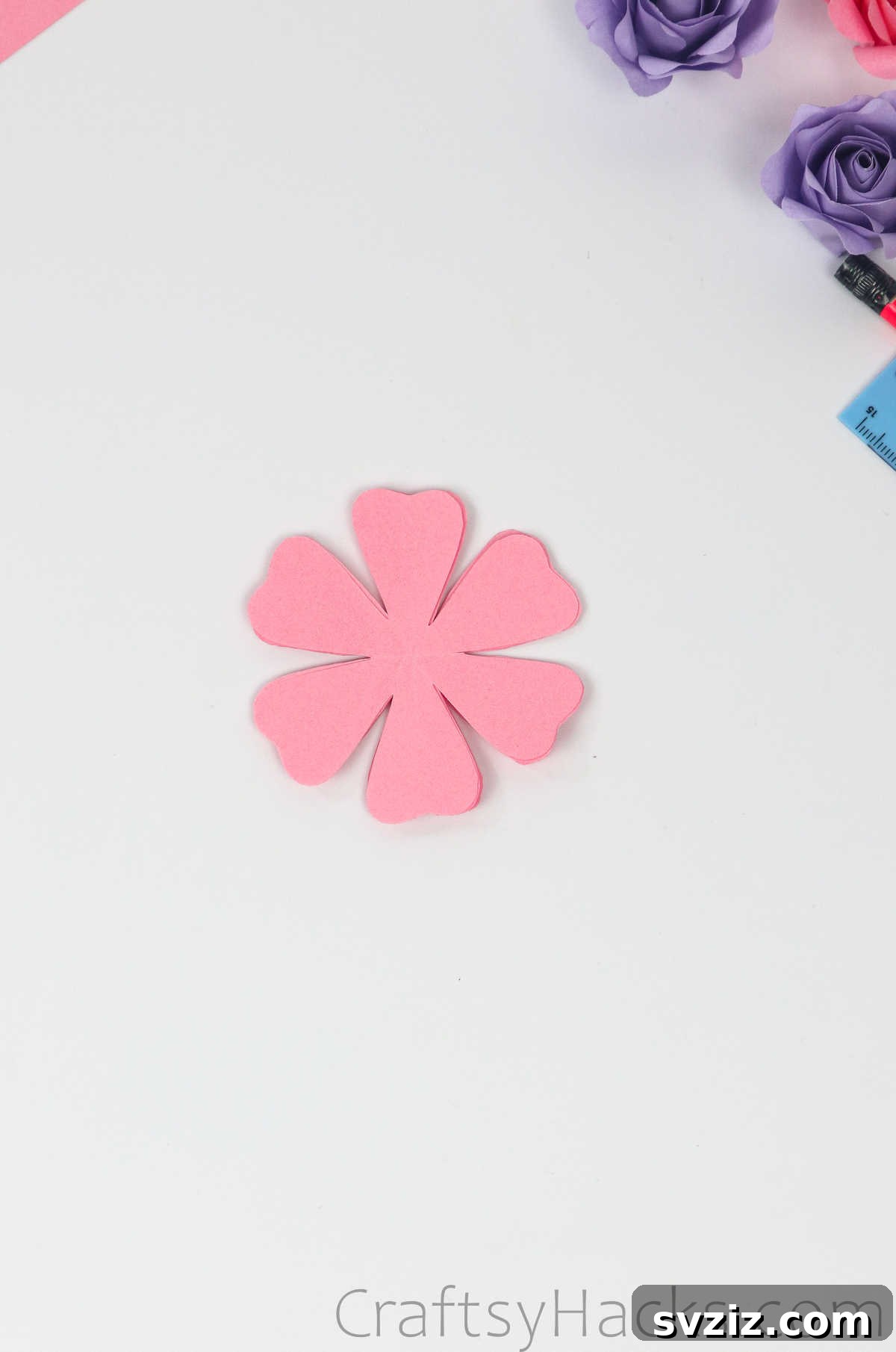 Your Simple Guide to Gorgeous Paper Roses 18 Four six-petal paper flower cut-outs neatly stacked together