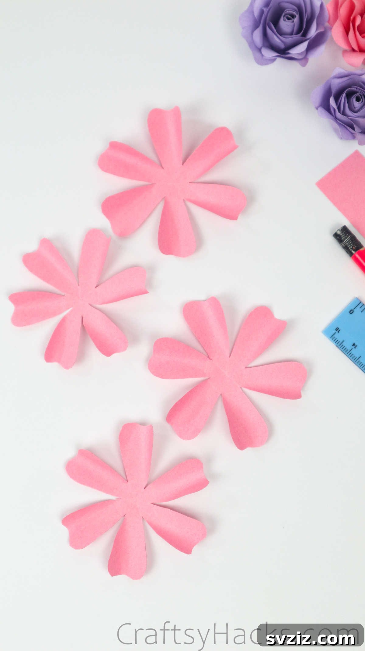 Your Simple Guide to Gorgeous Paper Roses 23 All four pink paper flower pieces, each with gently curved petals from the skewer shaping