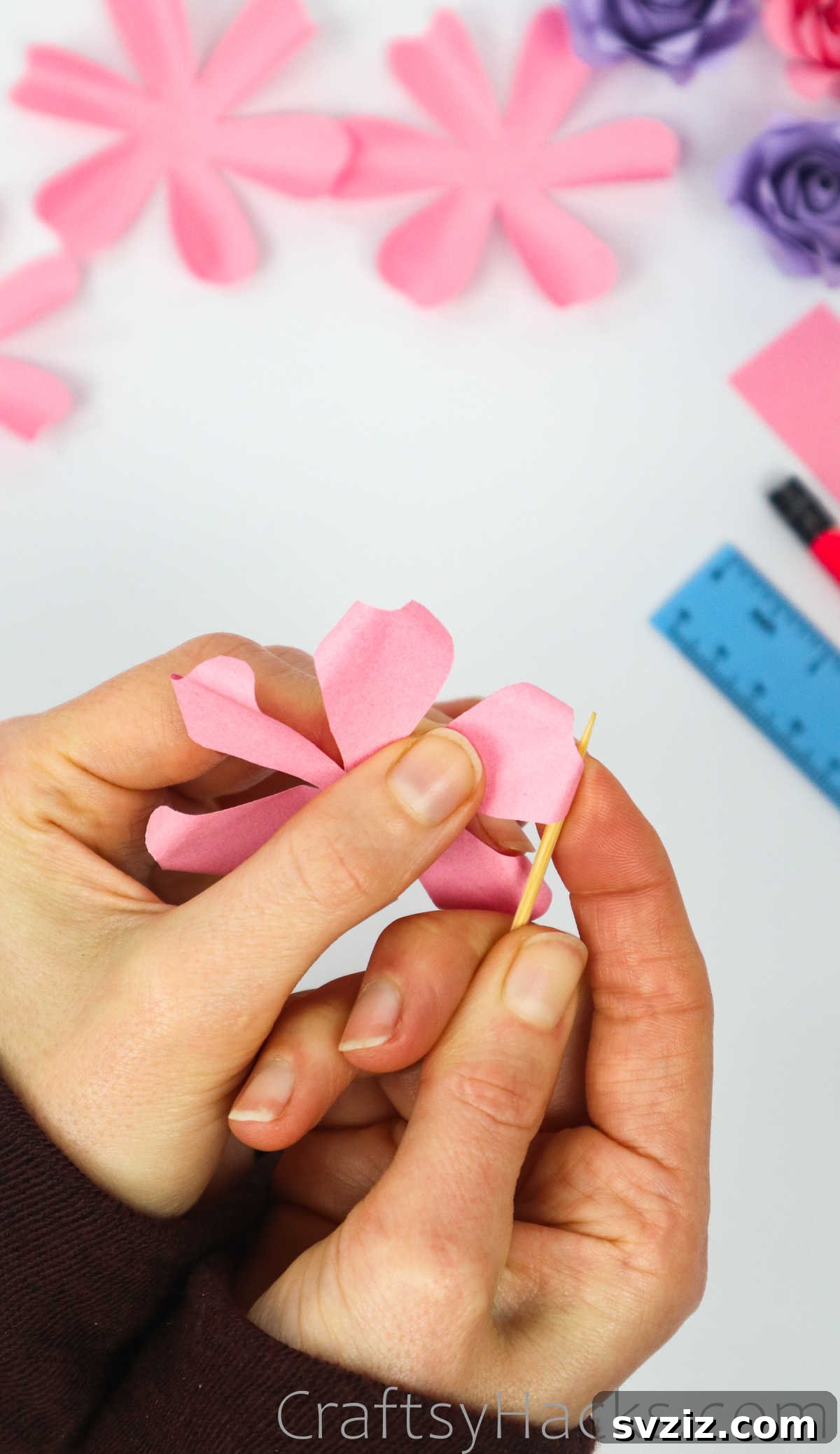 Your Simple Guide to Gorgeous Paper Roses 25 A closer view of a paper petal with its tip beautifully curled using a toothpick
