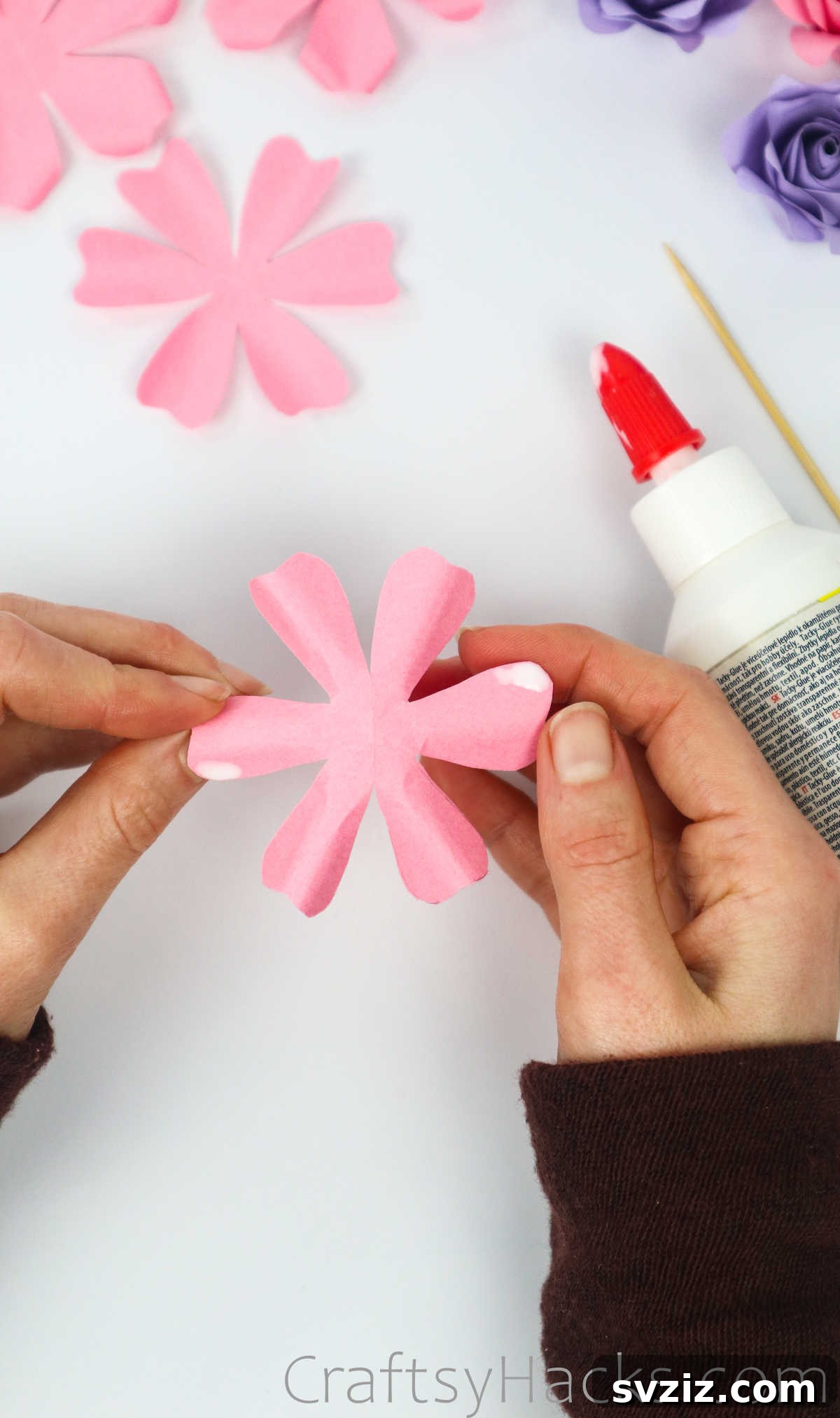 Your Simple Guide to Gorgeous Paper Roses 29 Close-up of a paper petal with a small amount of glue at its tip
