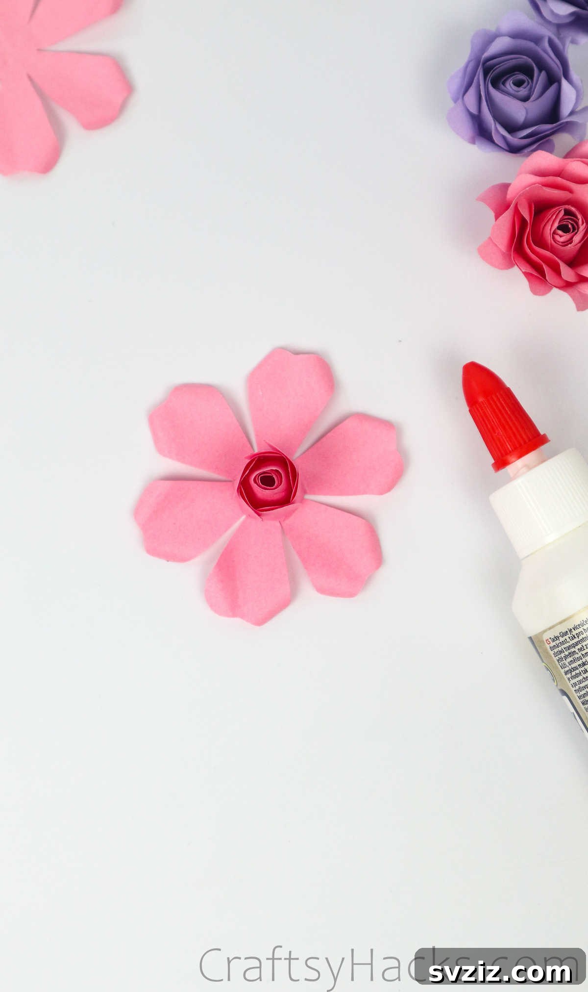 Your Simple Guide to Gorgeous Paper Roses 42 Attaching the growing rose bud onto the center of an outer petal layer