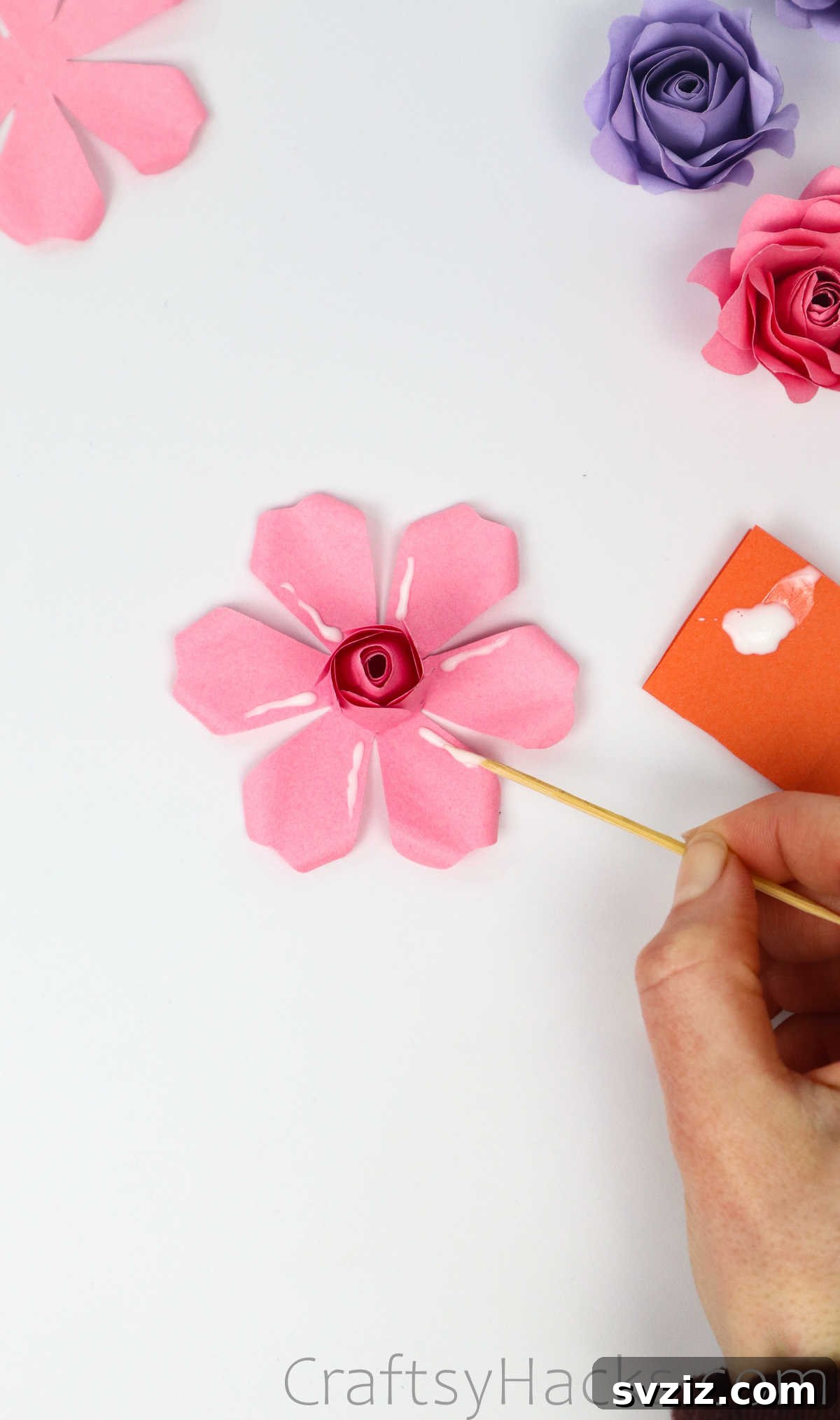 Your Simple Guide to Gorgeous Paper Roses 43 Applying glue along the petals of the outer layer before attaching them to the rose