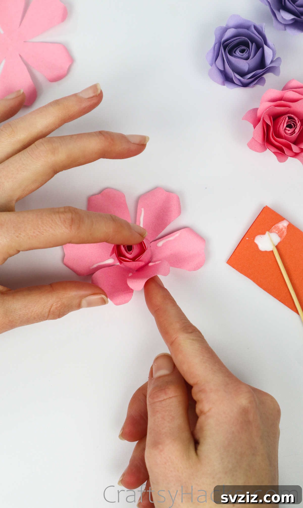 Your Simple Guide to Gorgeous Paper Roses 44 Gluing the outer petals to the rose's center, gradually building volume