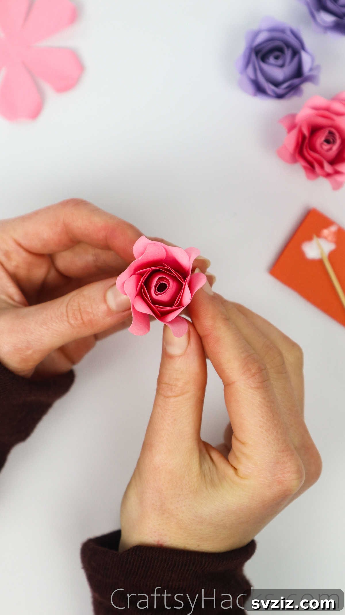 Your Simple Guide to Gorgeous Paper Roses 45 The rose taking shape as more outer petals are glued down, adding depth
