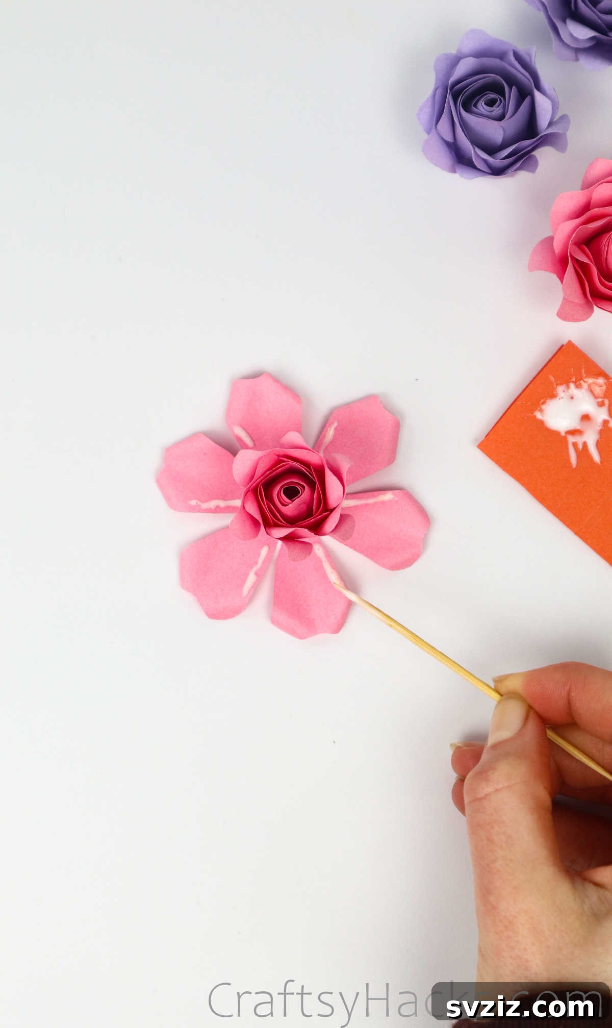 Your Simple Guide to Gorgeous Paper Roses 47 Applying glue to the petals of the final outermost layer of the paper rose