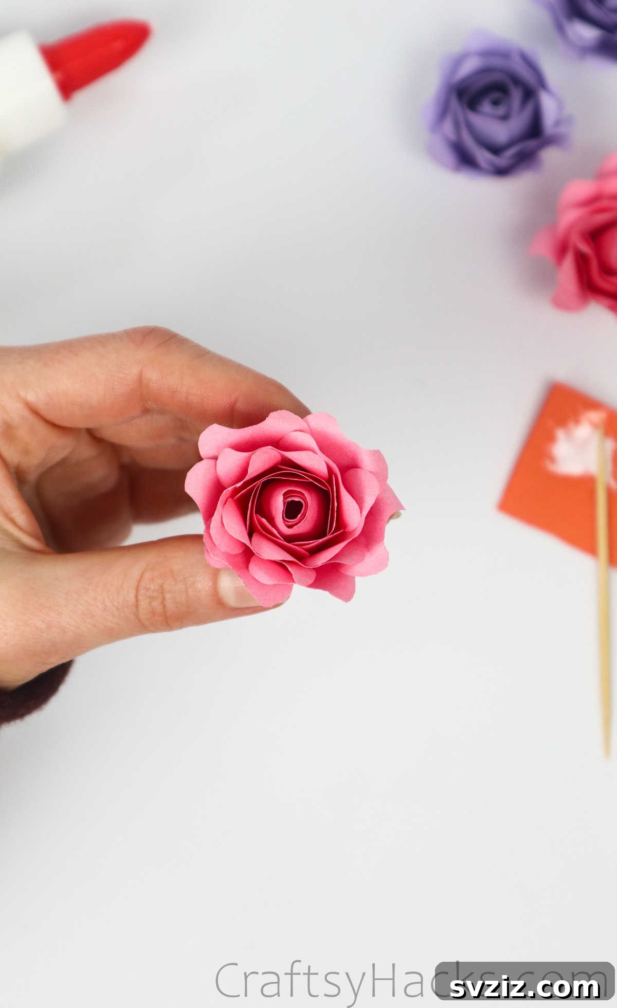 Your Simple Guide to Gorgeous Paper Roses 49 The completed paper rose with all its layered and curled petals securely glued, showcasing a full bloom