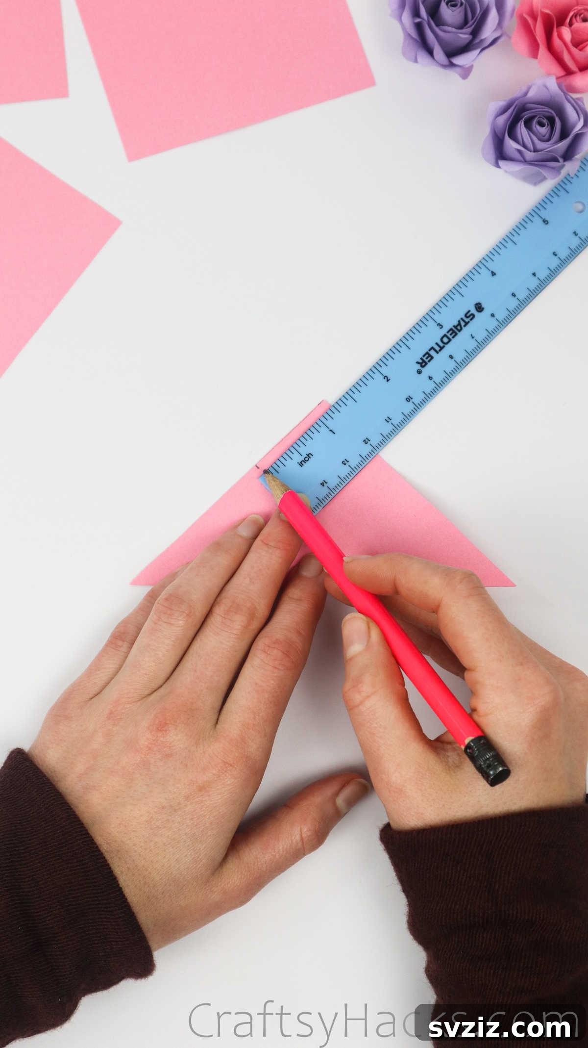 Your Simple Guide to Gorgeous Paper Roses 9 A pencil mark indicating 1.5 inches down on the folded paper triangle