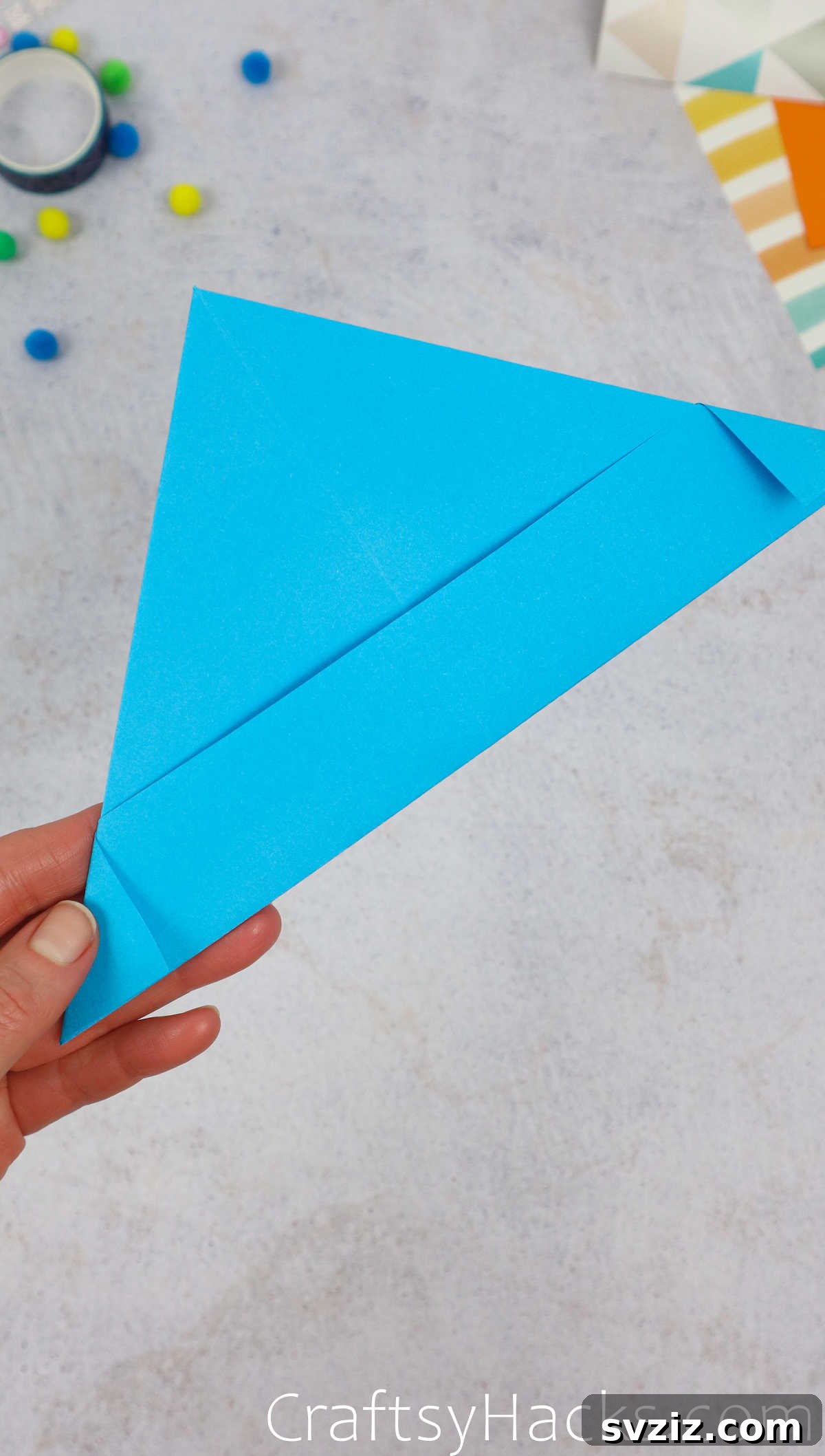 Both corners of the paper hat are folded inwards and secured, showing a clean, finished look.