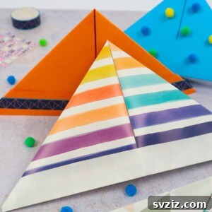 A beautifully decorated paper hat on a wooden surface, highlighting the finished craft.