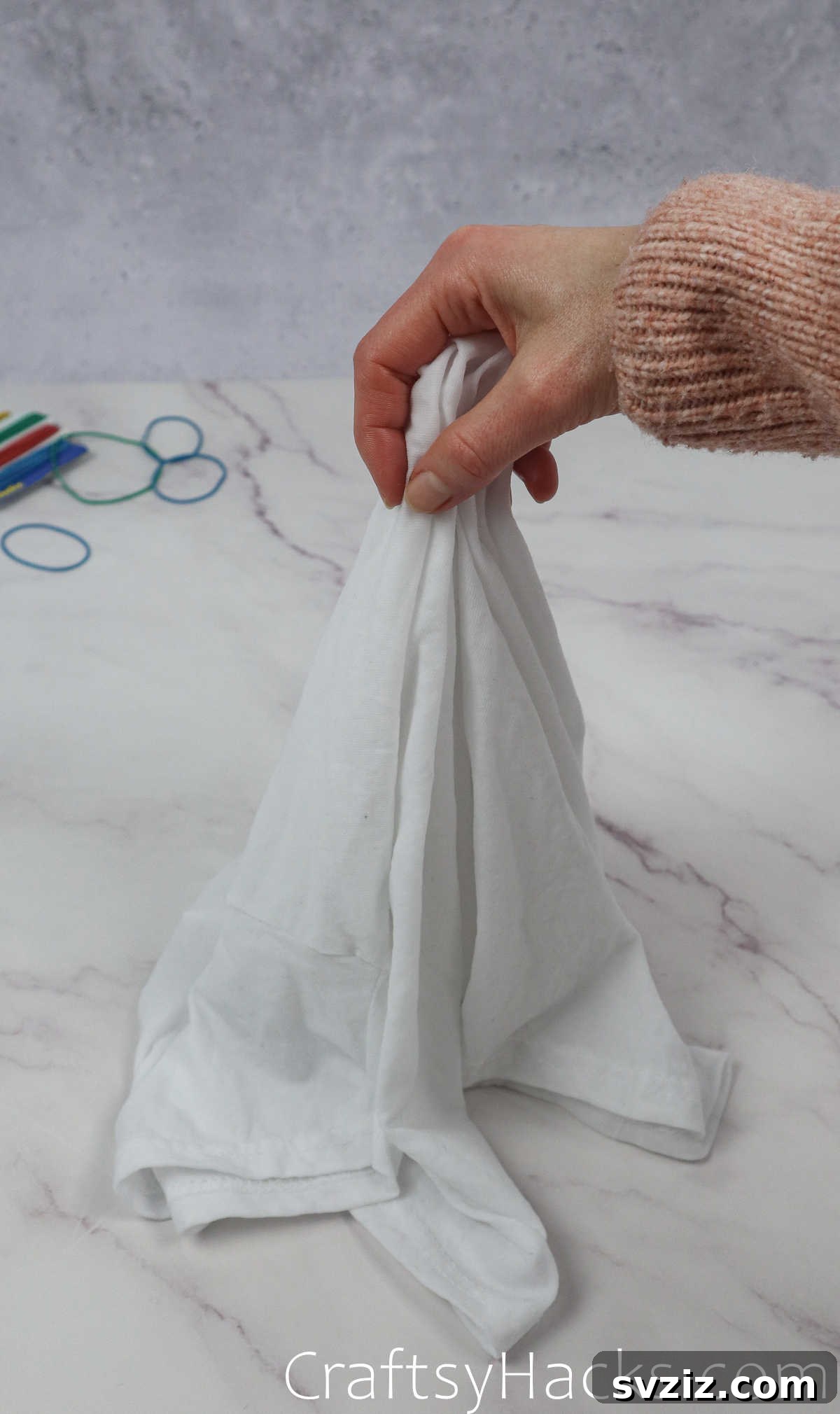 holding center of shirt
