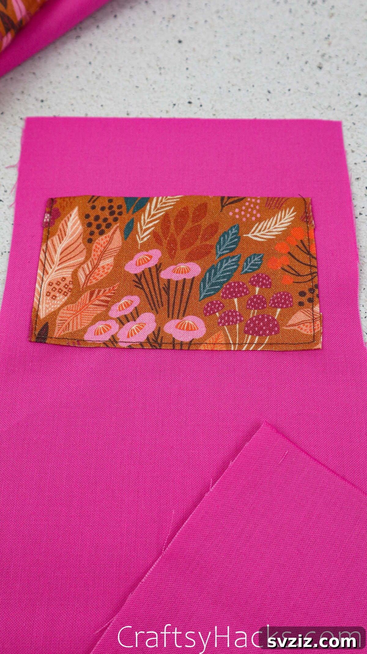 A sewing machine stitching the sides of the fabric pocket onto the lining, carefully avoiding the top opening.