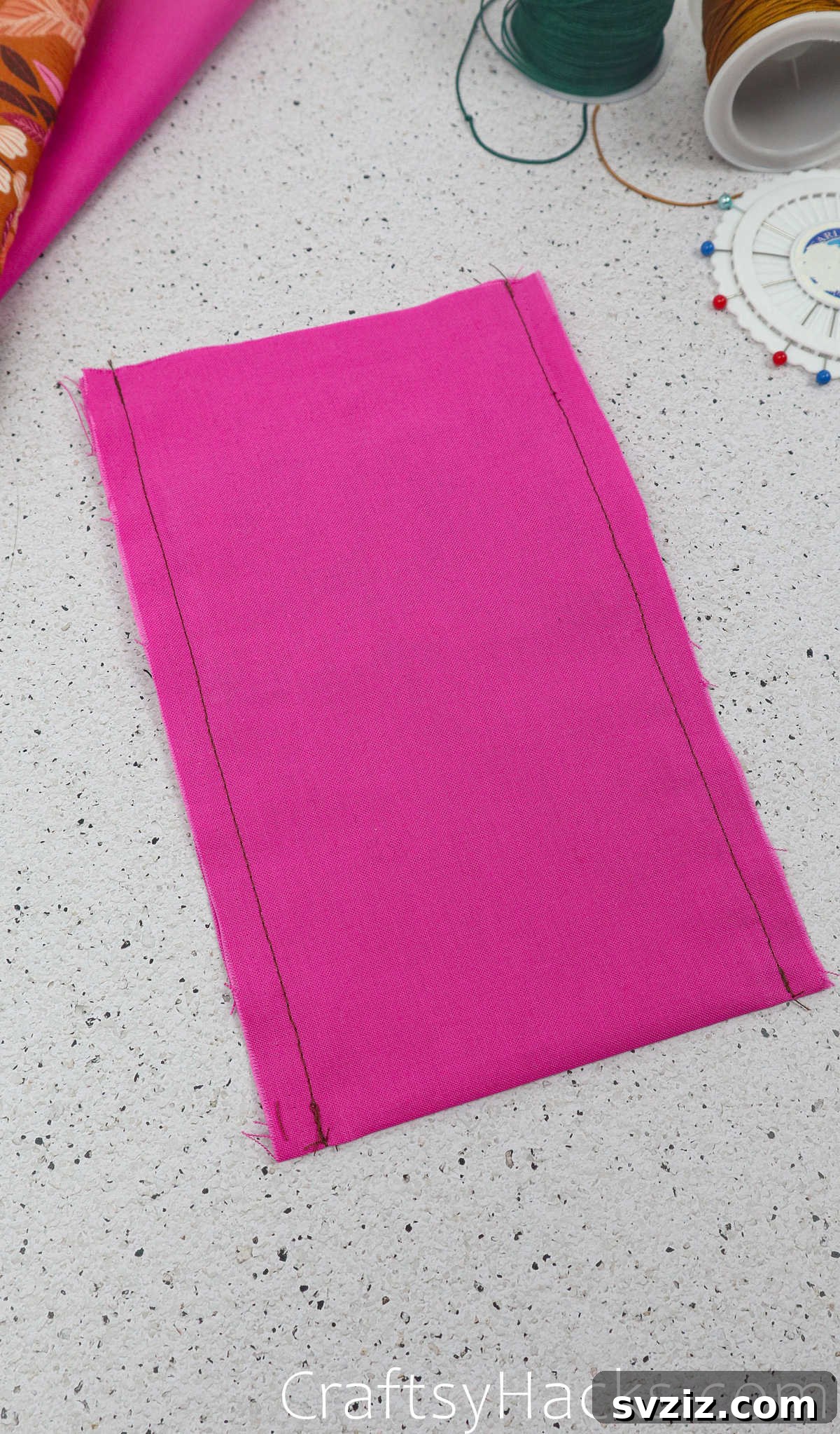 The lining fabric with its two sides sewn, creating a pouch with a neat quarter-inch seam allowance.