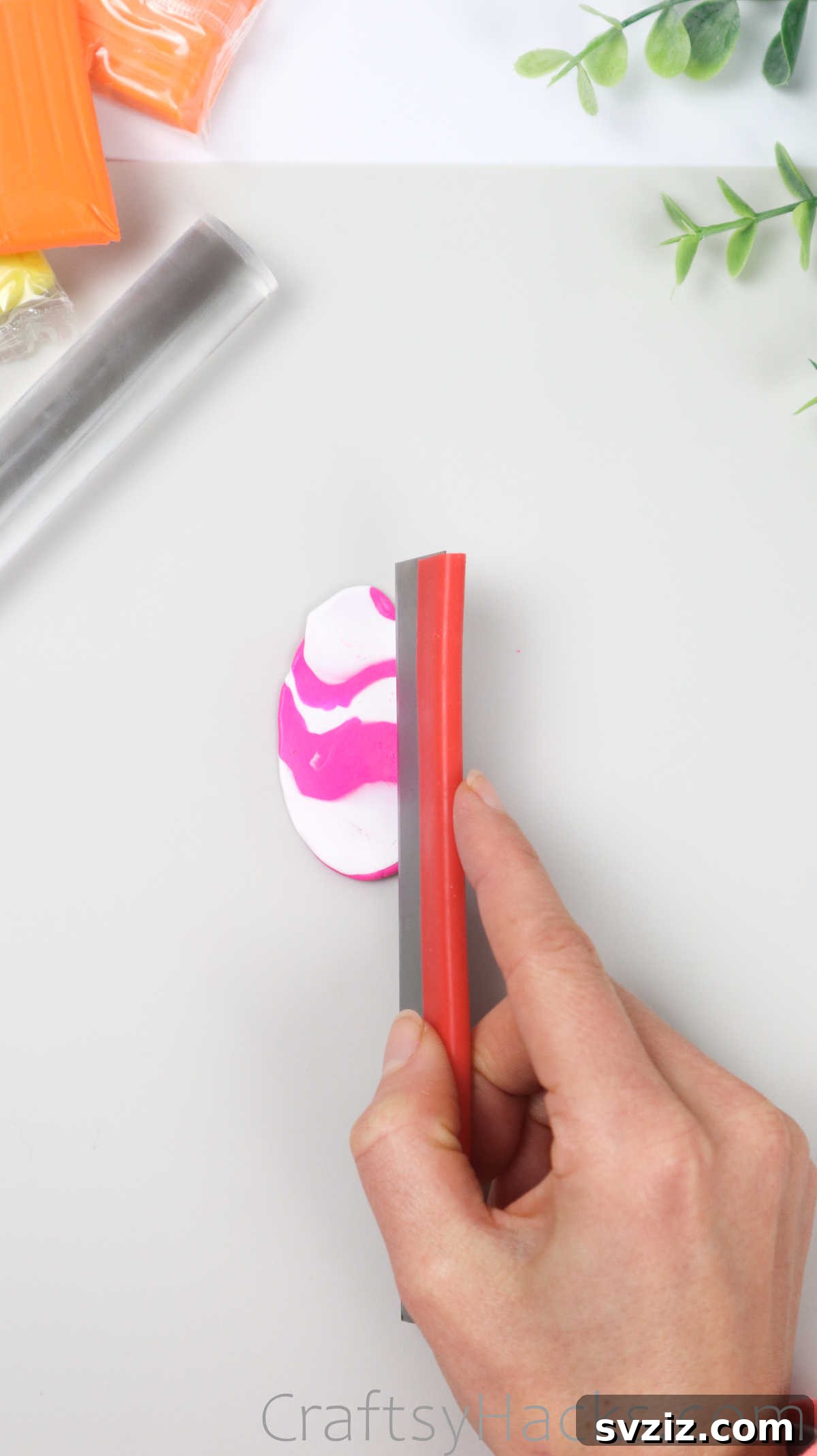 Crafting Your Own Clay Rings Effortlessly 29 A craft knife cutting a flattened sheet of marbled polymer clay into three distinct strips