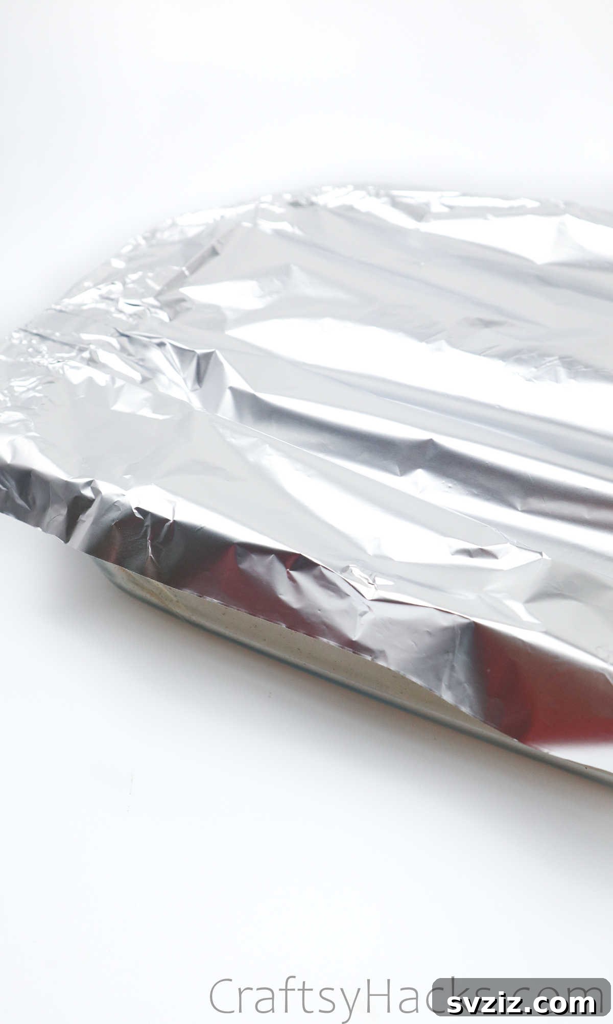 Crafting Your Own Clay Rings Effortlessly 33 A baking tray with clay rings covered with aluminum foil, ready for the oven